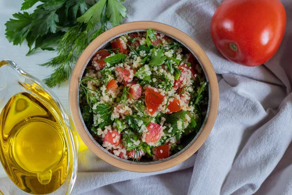 Arabic Salad Tabbouleh with couscous, parsley, tomato and olive oil — Stockfoto