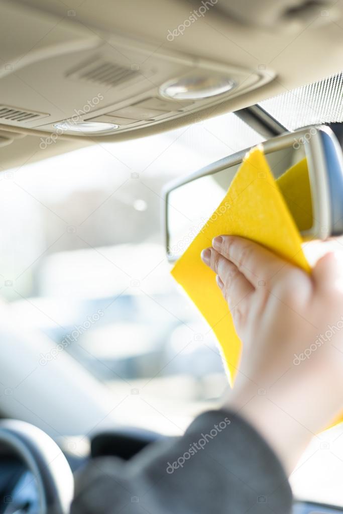 Cleaning mirror in a car