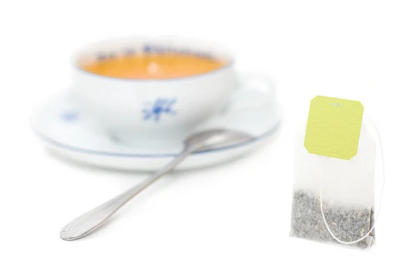 Tea bag with cup of tea — Stock Photo, Image