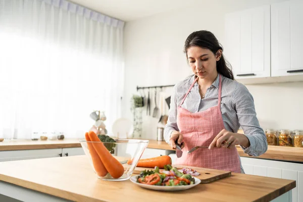 Caucasian Loving Woman Wear Apron Cook Green Salad Kitchen Home — Zdjęcie stockowe