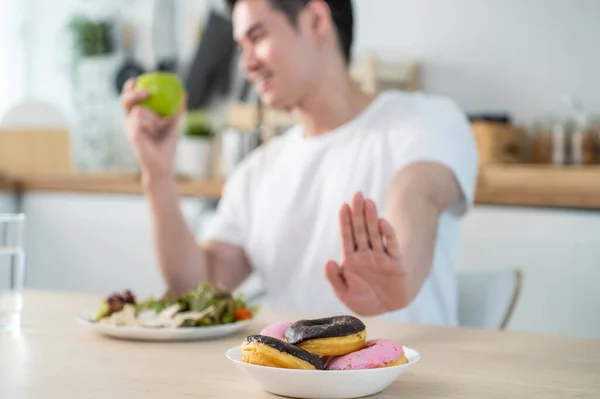 Asian Active Handsome Man Reject Donut Enjoying Eat Healthy Food — Stockfoto