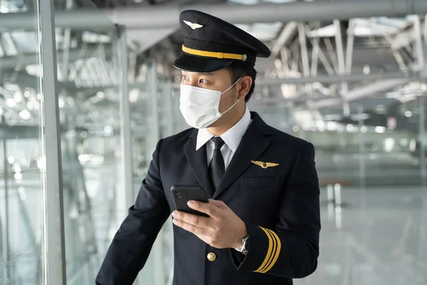 Asian Airliner Pilot Wearing Face Mask Standing Airport Terminal Young — Stock fotografie