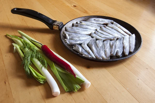 Fresh fish on an old frying pan — Stock Photo, Image