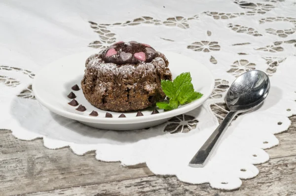 Diet chocolate cupcakes on yeliow plate mint leaf — Stock Photo, Image