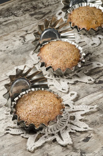 Pumpkin muffins in aluminum baking dish on old table — Stock Photo, Image