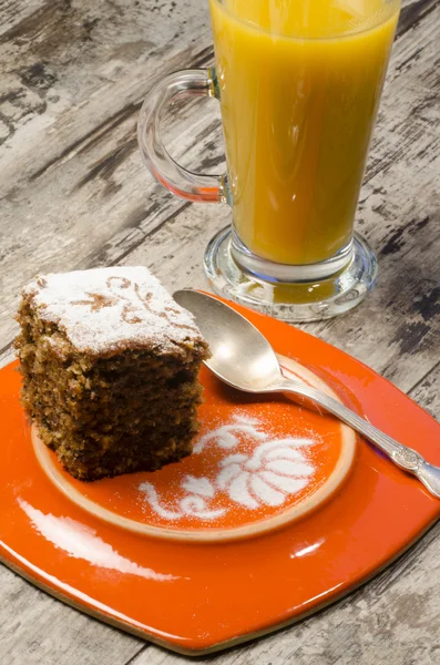 Pumpkin cake on plate and juice — Stock Photo, Image