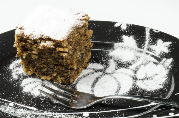 Κέικ κολοκύθας στο μαύρο πιάτο διακοσμημένα μοτίβο — Φωτογραφία Αρχείου