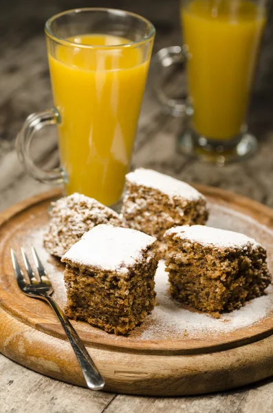 Pumpkin cake on wooden cutting board — Stock Photo, Image