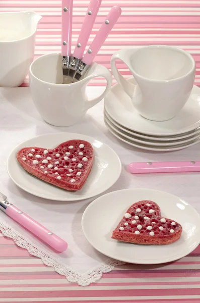 Valentine's Day red pancakes in heart shape with sour cream — Stock Photo, Image