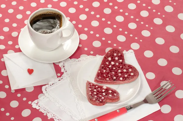 Valentine's Day red pancakes in heart shape with sour cream — Stock Photo, Image