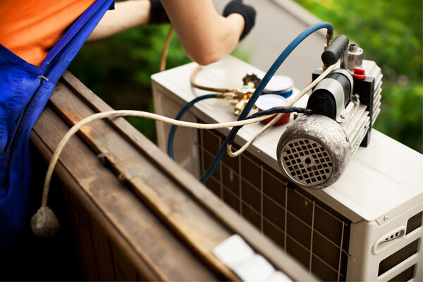 Air conditioning master preparing to install new air conditioner