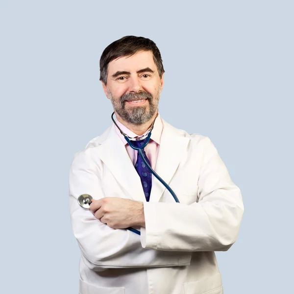 Portrait of happy middle-aged doctor with stethoscope. on a whit — Stock Photo, Image