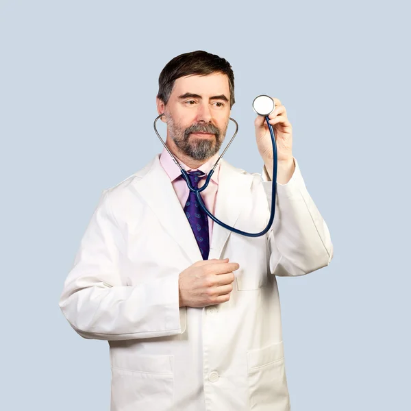 Doctor with a stethoscope listening — Stock Photo, Image