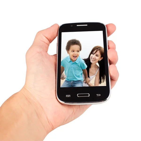 Hand innehav smart telefon, familj kräver. isolerade på vit baksida — Stockfoto