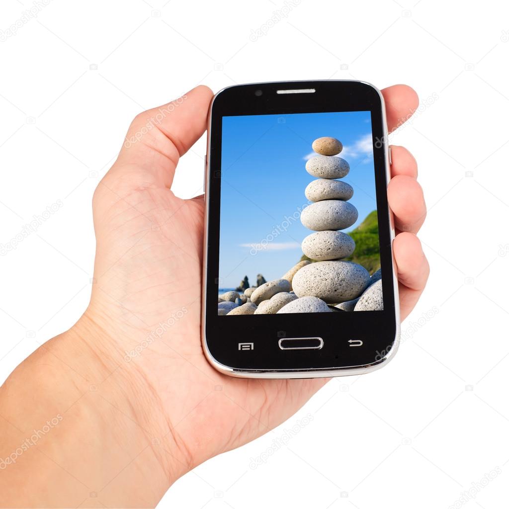 Hand holding smart phone, balance calling. isolated on white bac