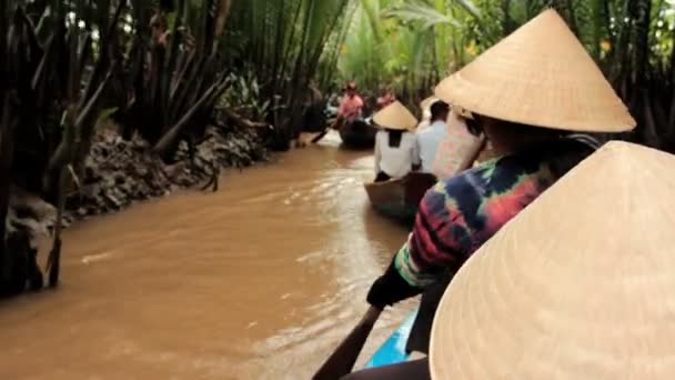 MEKONG DELTA, VIETNAM - JULY 24: woman rows a boat on a canal, — Stock Video