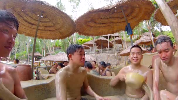 People at mud bathing spa — Stock Video