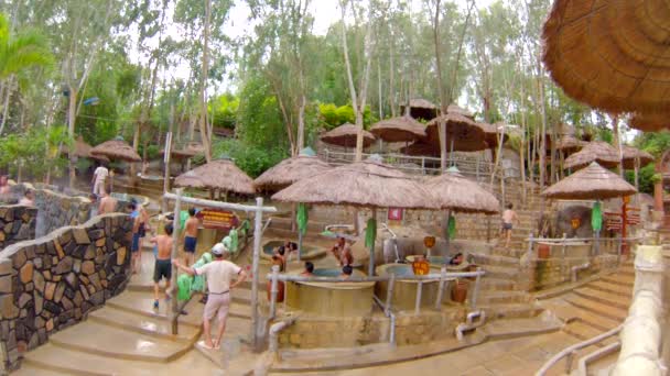 People at mud bathing spa — Stock Video