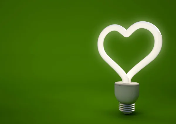 Bombilla de ahorro de energía en forma de corazón — Foto de Stock