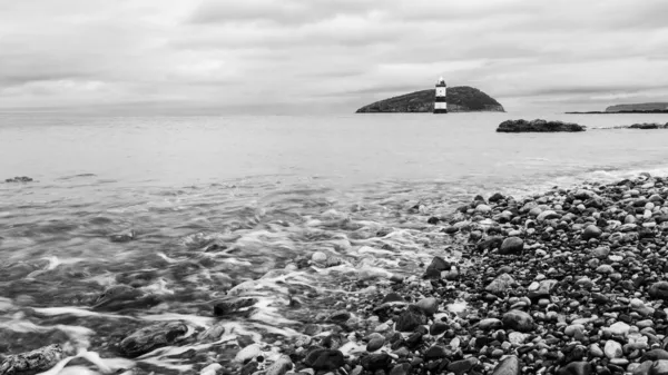 Penmon point in black and white seen on the coast of Anglesey, North Wales in October 2021.