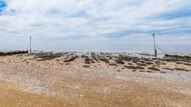 Kuzey Norfolk sahilindeki Hunstanton sahilindeki kaya havuzlarının çoklu görüntüsü..