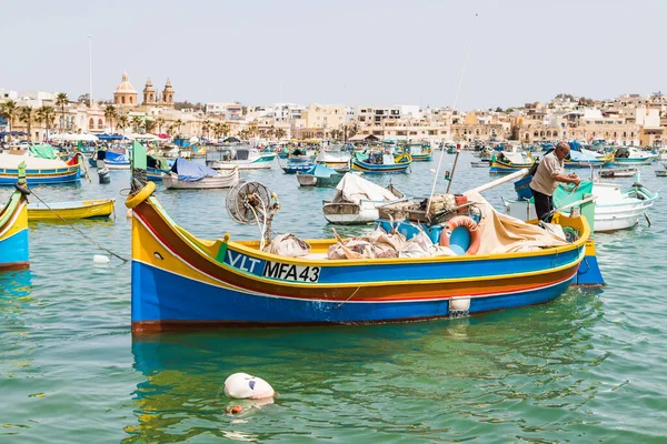 A fisherman takes his luzzu boat out of the harbour at Marsaxlokk, Malta in April 2022.