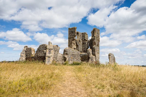 Ruined church of St James pictured under a blue sky in Bawsey, West Norfolk in July 2022.