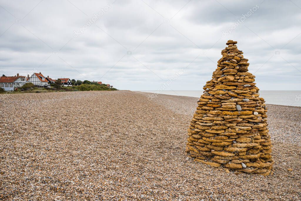 A pyramid of rocks pictured on the beach at Thorpeness on the Suffolk coast in July 2022.