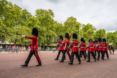 Soldier marching up The Mall towards Buckingham Palace for the Changing of the Guard ceremony in the heart of London seen in August 2022.