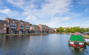 Narrow boat in Ellesmere Port canal basin pictured in Cheshire in August 2022.