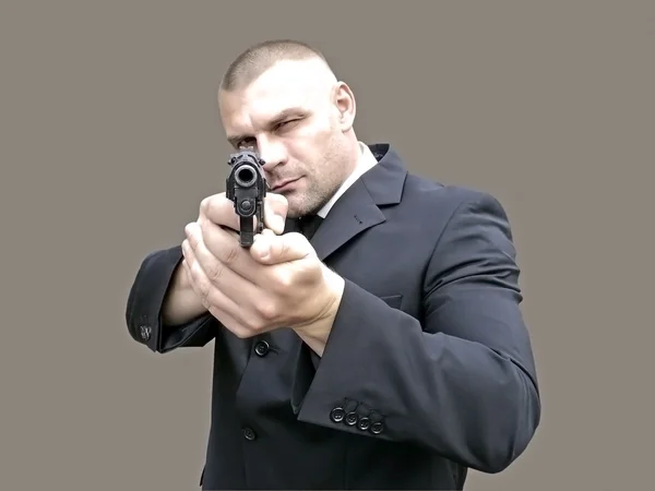 Un hombre con un arma —  Fotos de Stock