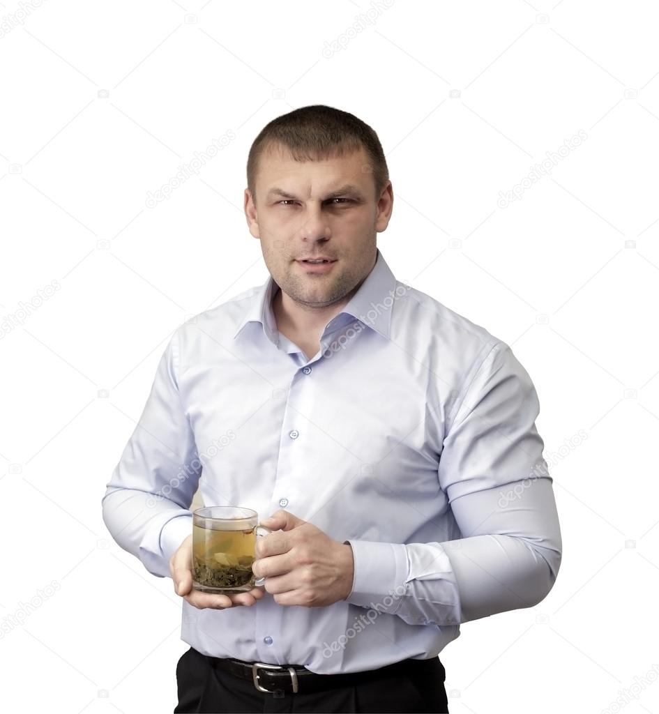 A man with a glass of tea