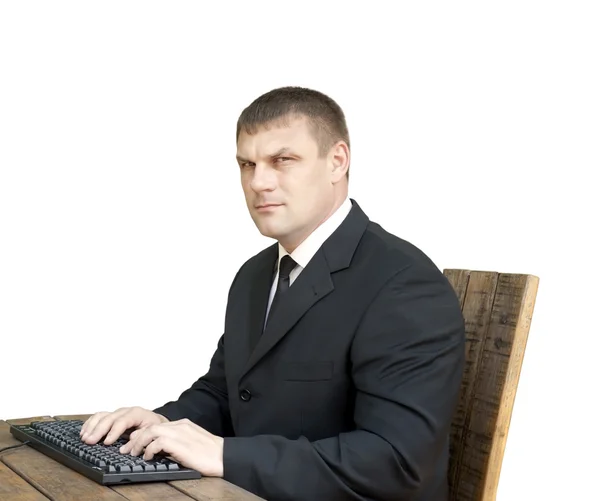 Um homem com um teclado de computador — Fotografia de Stock