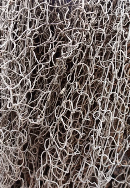 Old vintage texture of a fishing net woven from