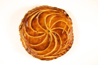 Galette des rois on wooden table, Traditional Epiphany cake in France