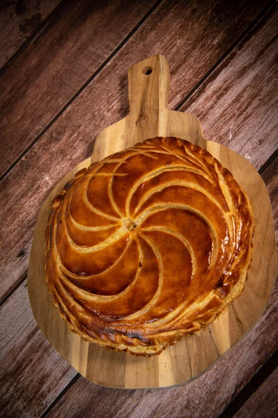 Galette des rois on wooden table, Traditional Epiphany cake in France — Φωτογραφία Αρχείου