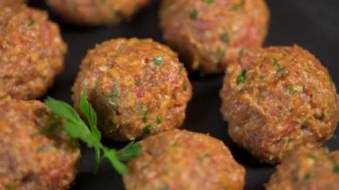 Recipe for meatballs before cooking on turntable