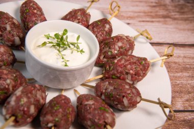 Recipe of kefta, beef skewer, Traditional homemade, with Greek yoghurt sauce, garlic, savory, Arabic and Libanese food, High quality photo