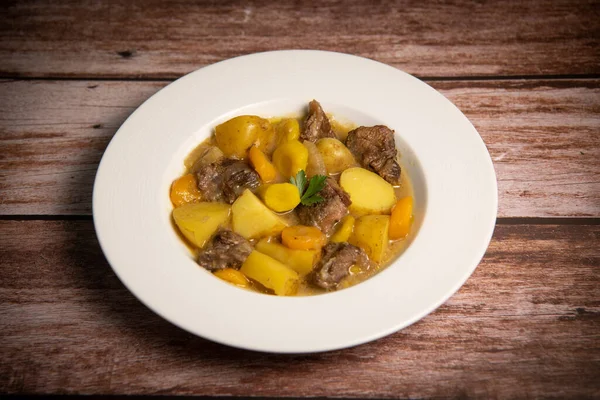 Recipe for beer and mustard beef chuck stew with potatoes, turnips and carrots, High quality photo