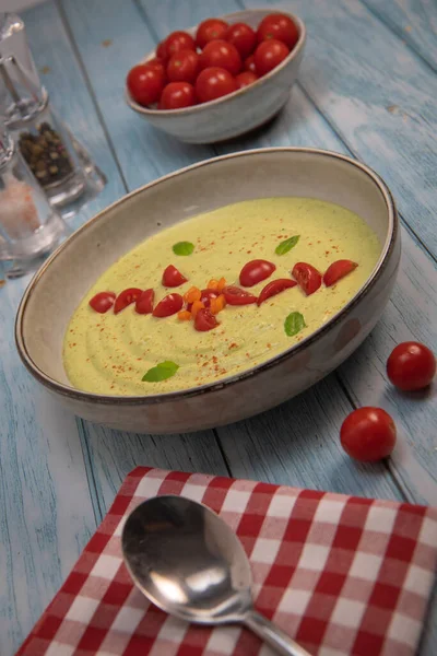 Vegan recipe for cucumber and courgette gazpacho with tomatoes. High quality photo