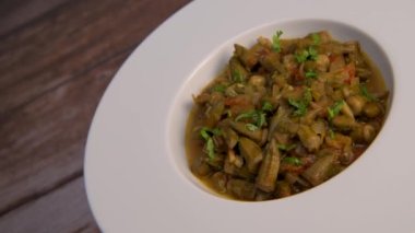 Bhindi masala or ladies finger fry served with indian roti chapati or Indian Flat bread. High quality video
