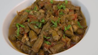 Bhindi masala or ladies finger fry served with indian roti chapati or Indian Flat bread. High quality video