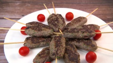 Recipe of kefta, beef skewer, Traditional homemade, with small tomatoes, Arabic and Libanese food, Hight quality