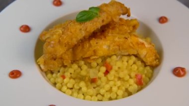 Recipe for chicken tenders with corn flakes and Italian Piombo pasta risotto and peppers. High quality video