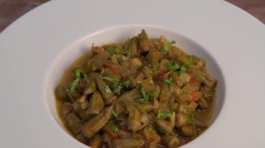 Bhindi masala or ladies finger fry served with indian roti chapati or Indian Flat bread. High quality video