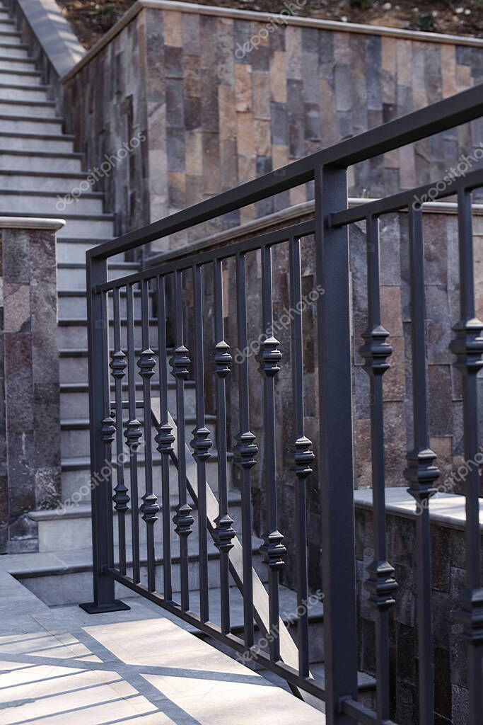 Modern metal railings and handrails in the loft style. The metal is