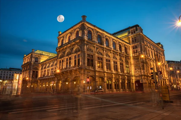 Vienna State Opera at night, Vienna, Austria. Wien opera building facade at night and traffic trails.