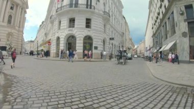 Vienna, Austria - June 6, 2022. 4K slow motion of St. Stephen's Cathedral, Wien, Vienna Austria. Blue sky with clouds on cloudy tourist day. Evening and historic buildings.