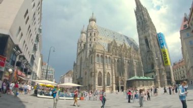 Vienna, Austria - June 6, 2022. 4K slow motion of St. Stephen's Cathedral, Wien, Vienna Austria. Blue sky with clouds on cloudy tourist day. Evening and historic buildings.