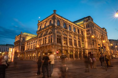 Vienna State Opera at night, Vienna, Austria. Wien opera building facade at night and traffic trails.